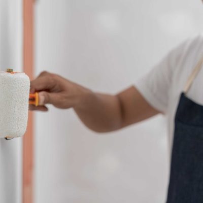 painter man, brush in hand for products to restore and paint the wall, indoor the building site of a house, wall during painting, renovation, painting, contractor, Architect, construction worker